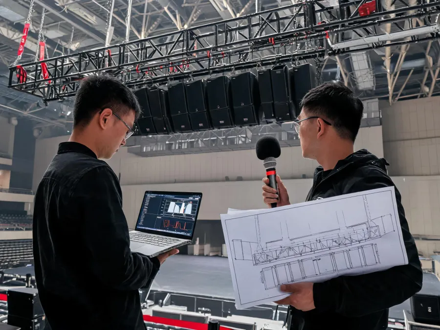 Audio engineers commissioning a loudspeaker system